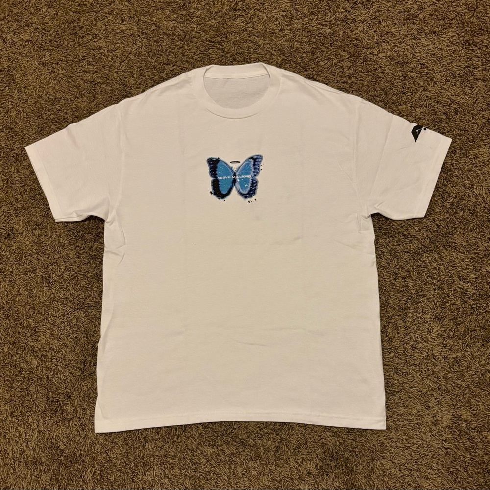 Above Millions Tee